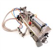 دستگاه پرکن مایعات رقیق 10 الی 100 میلی لیتر پنوماتیک سیستم مکنده خلاء مدل F9